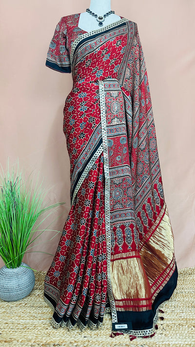 Hand block Ajrakh print Red modal silk saree with gotta patti border, with stitched blouse