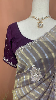 Gold and Silver striped Tissue silk saree with hand embroidery and contrast blouse