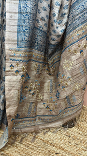 Printed Tussar silk saree with hand emroidery and stitched blouse