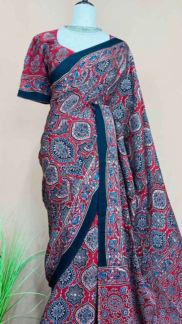 Red modal silk saree with ajrakh print on pallu and blouse, with stitched blouse