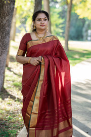 Maroon Kanchivaram silk hand woven saree with stitched blouse