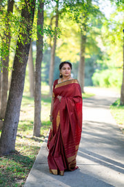 Maroon Kanchivaram silk hand woven saree with stitched blouse