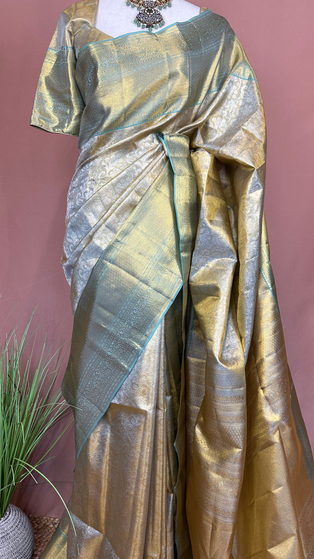 Gold and pastel green brocade kanchivaram pure silk saree with stitched blouse