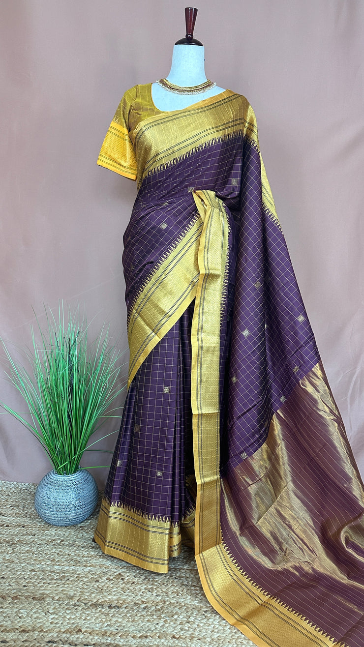 Coffe Brown semi silk saree with yellow temple border, with stitched blouse