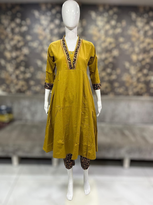 mustard yellow cotton kurti with handwork on back neck , and bottom