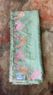 Light green crushed tissue saree with cut work, with stitched blouse