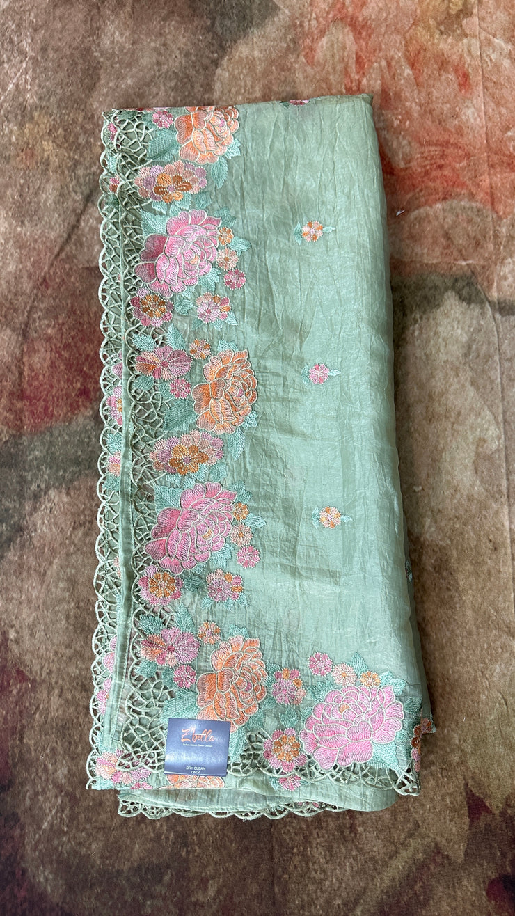 Light green crushed tissue saree with cut work, with stitched blouse