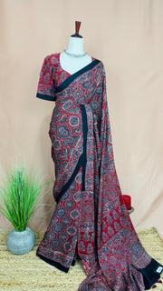 Red modal silk saree with ajrakh print on pallu and blouse, with stitched blouse