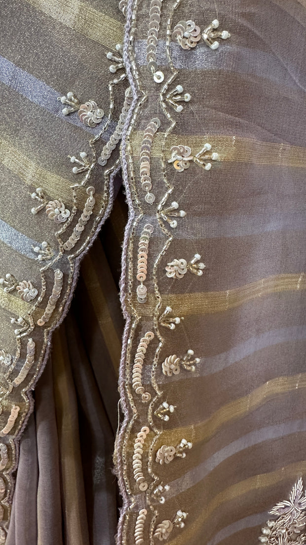 Gold and Silver striped Tissue silk saree with hand embroidery and contrast blouse