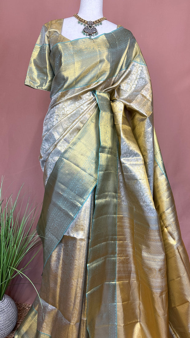 Gold and pastel green brocade kanchivaram pure silk saree with stitched blouse