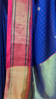 Navy blue semi silk saree with orange temple border, with stitched blouse