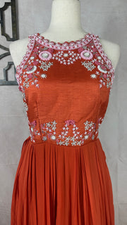 Orange crepe halterneck gown with embrodery