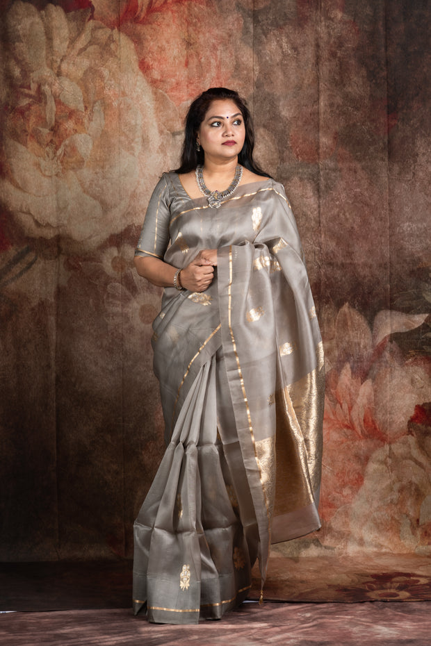 Hand woven Grey Kora Banarsi saree with silver and gold zari stitched blouse