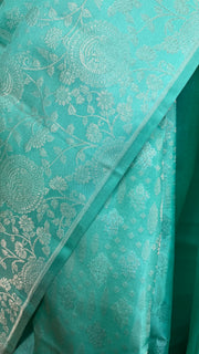 Jade green brocade saree with stitched blouse