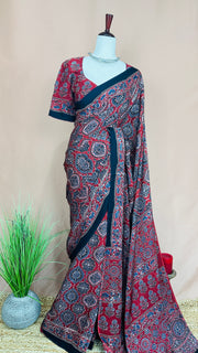 Red modal silk saree with ajrakh print on pallu and blouse, with stitched blouse