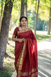 Maroon Kanchivaram silk hand woven saree with stitched blouse