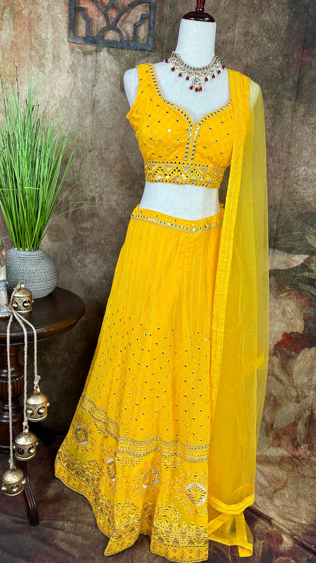 Yellow chikankari lehenga with foil mirror work