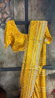 Mustard yellow modal silk saree with gotta work border, stitched blouse