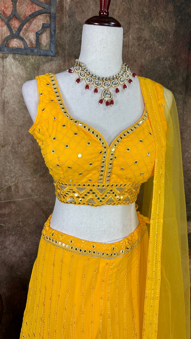 Yellow chikankari lehenga with foil mirror work