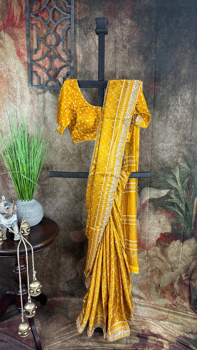 Mustard yellow modal silk saree with gotta work border, stitched blouse