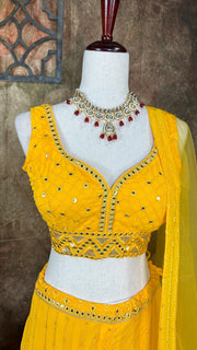 Yellow chikankari lehenga with foil mirror work