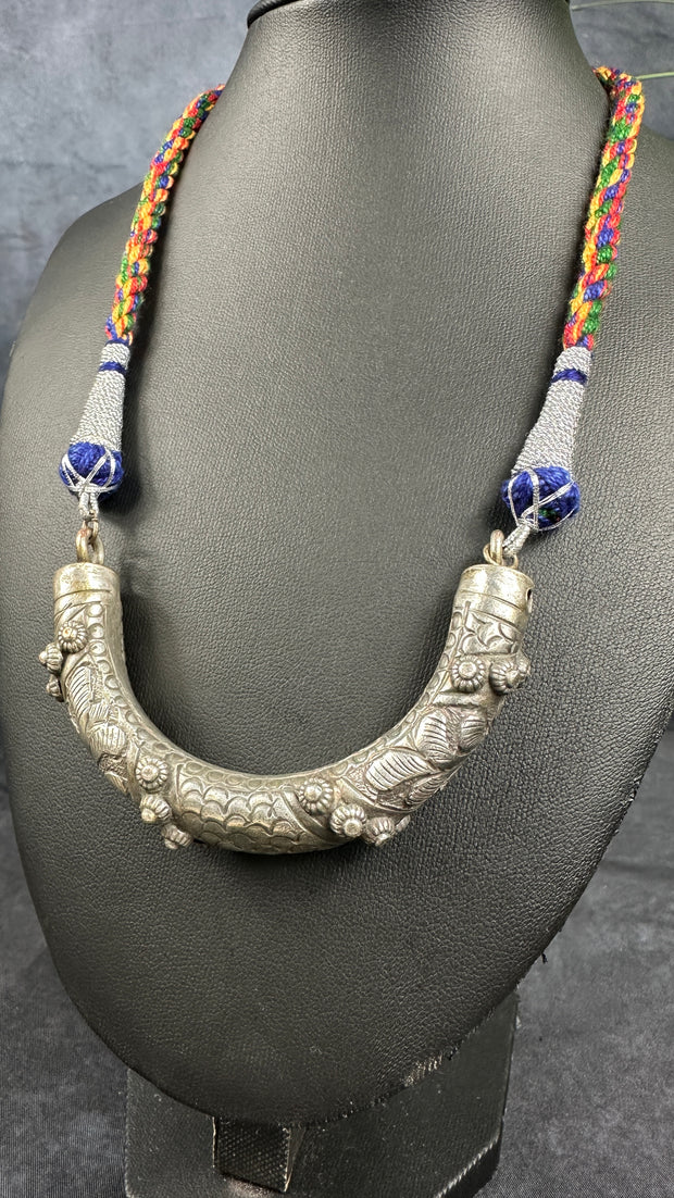 Thread with tribal pendent