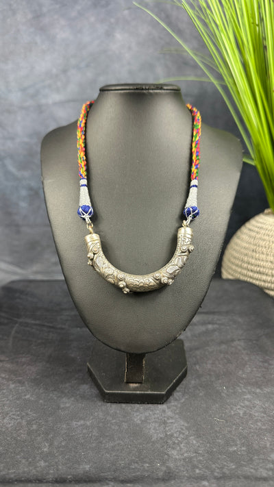 Thread with tribal pendent