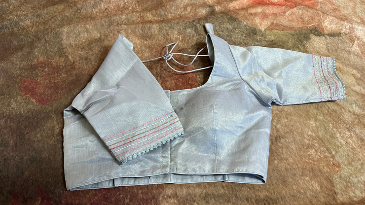 Grey tissue linen saree with hand emroidery and stitched blouse