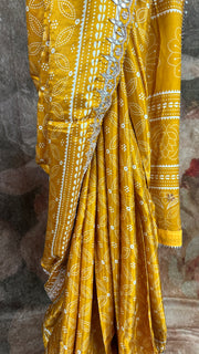 Mustard yellow modal silk saree with gotta work border, stitched blouse