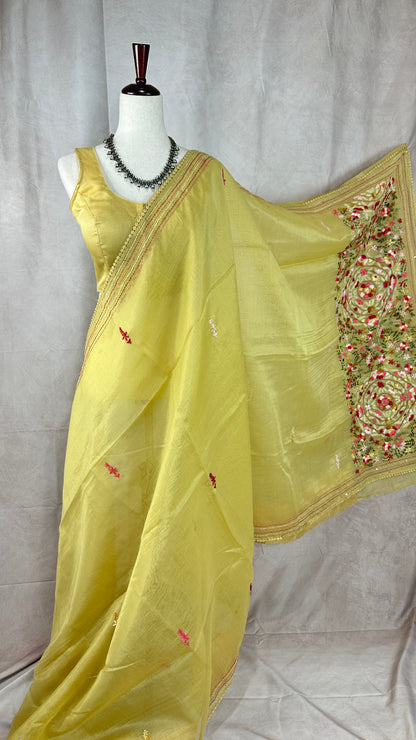 Light yellow tissue linen saree with hand emroidery and stitched blouse