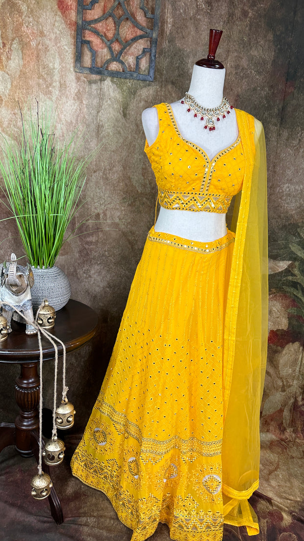 Yellow chikankari lehenga with foil mirror work