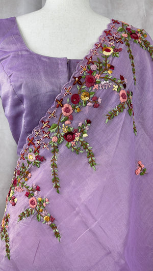 Lilac tissue linen saree with hand emroidery and stitched blouse