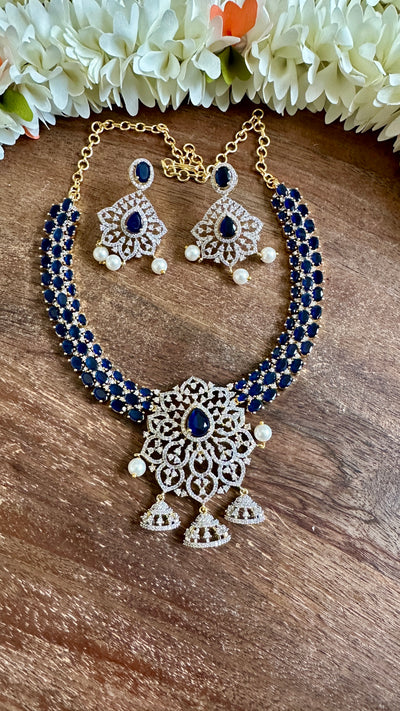 Diamond replica necklace with blue stone and earring