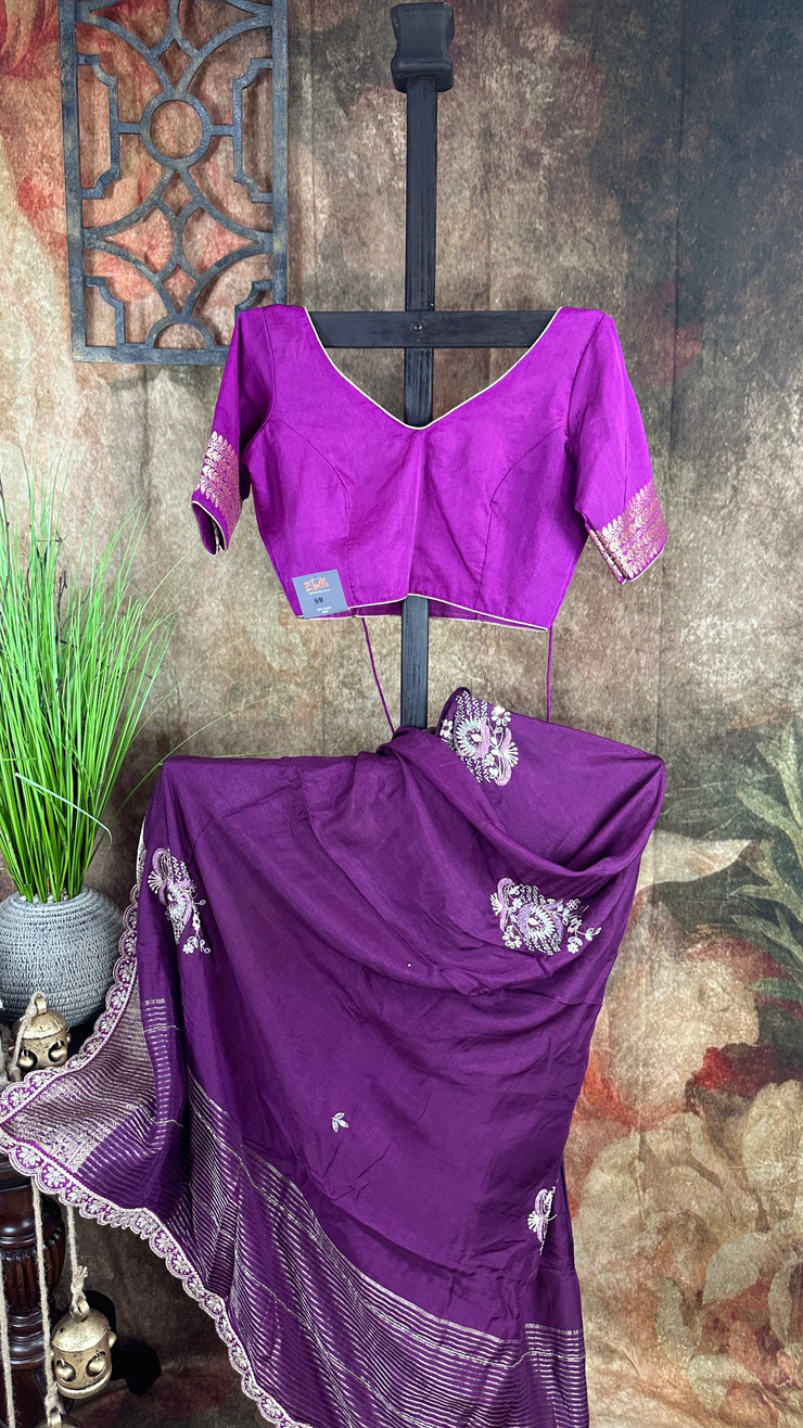 Purple Dola silk saree with hand embroidery, with light purple blouse.