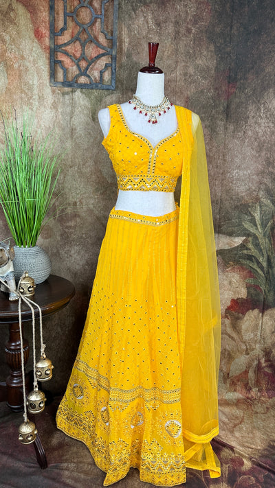 Yellow chikankari lehenga with foil mirror work