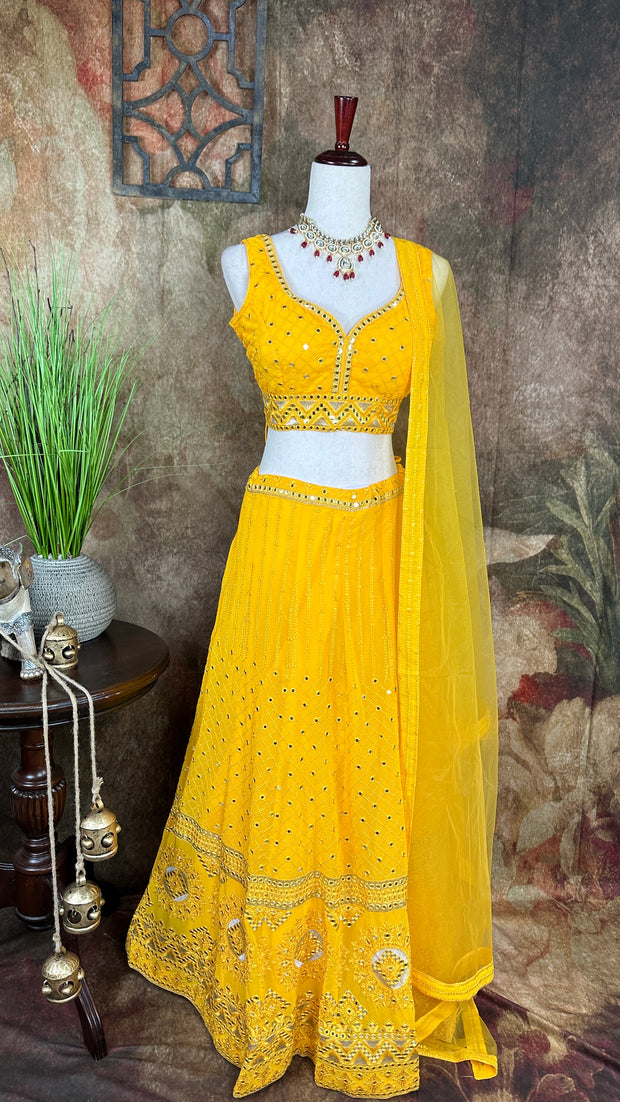 Yellow chikankari lehenga with foil mirror work