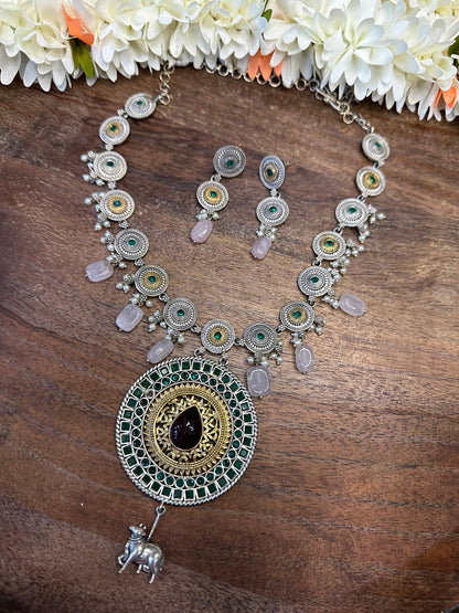 Dual tone necklace with green stone and earring