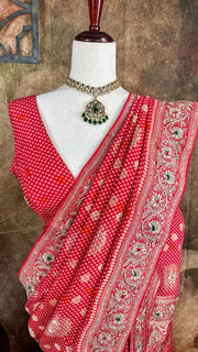 Red dola silk saree with zardosi hand work , with stitched blouse